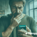 a man looking at a cigarette pack