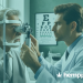 a man getting his eyes inspected by a doctor - hemppedia